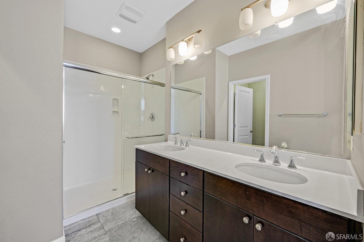 2908 Worthing Common Livermore, CA 94550 - Photo 12 of 33 a bathroom with a double vanity sink and a mirror