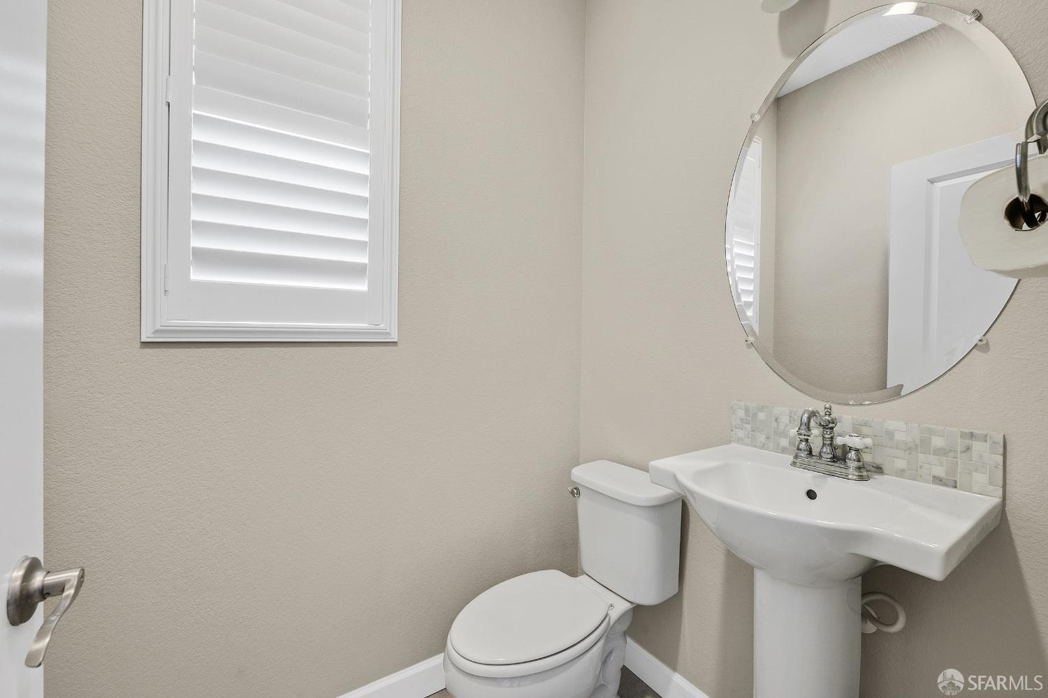 2908 Worthing Common Livermore, CA 94550 - Photo 20 of 33 a bathroom with a sink a toilet and mirror