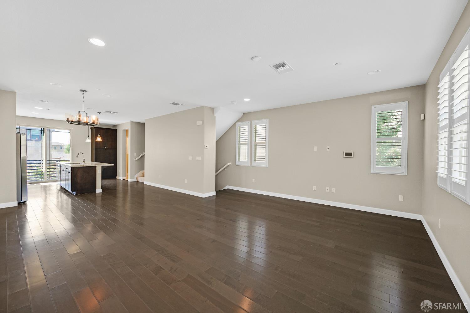 2908 Worthing Common Livermore, CA 94550 - Photo 23 of 33 an empty room with wooden floor and windows