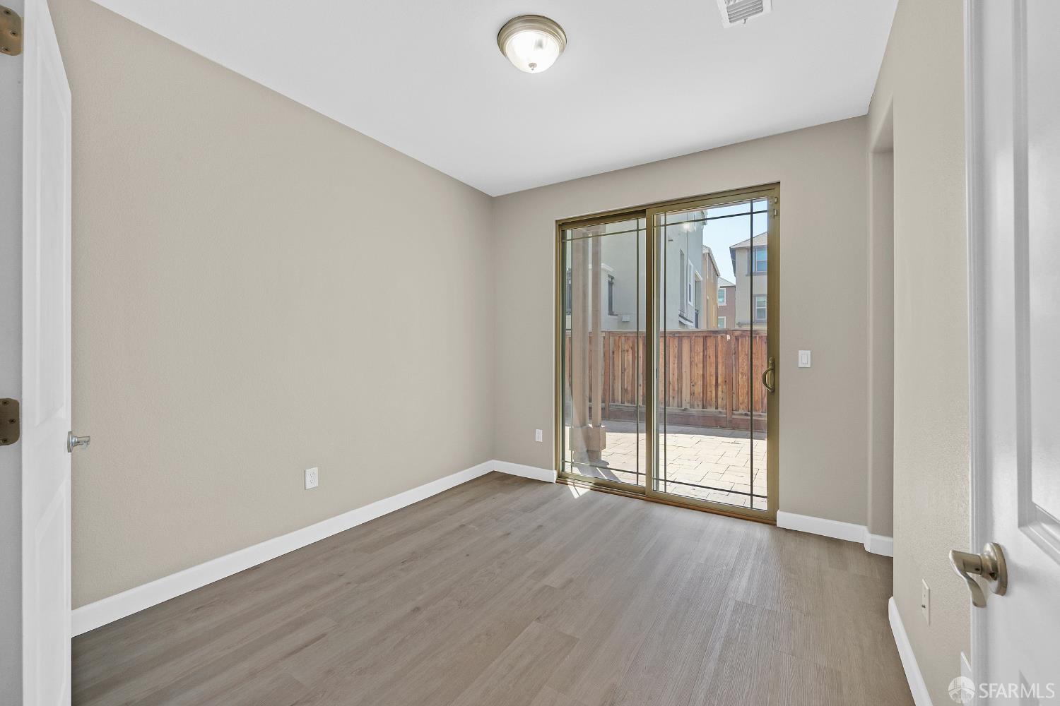 2908 Worthing Common Livermore, CA 94550 - Photo 26 of 33 an empty room with wooden floor and windows