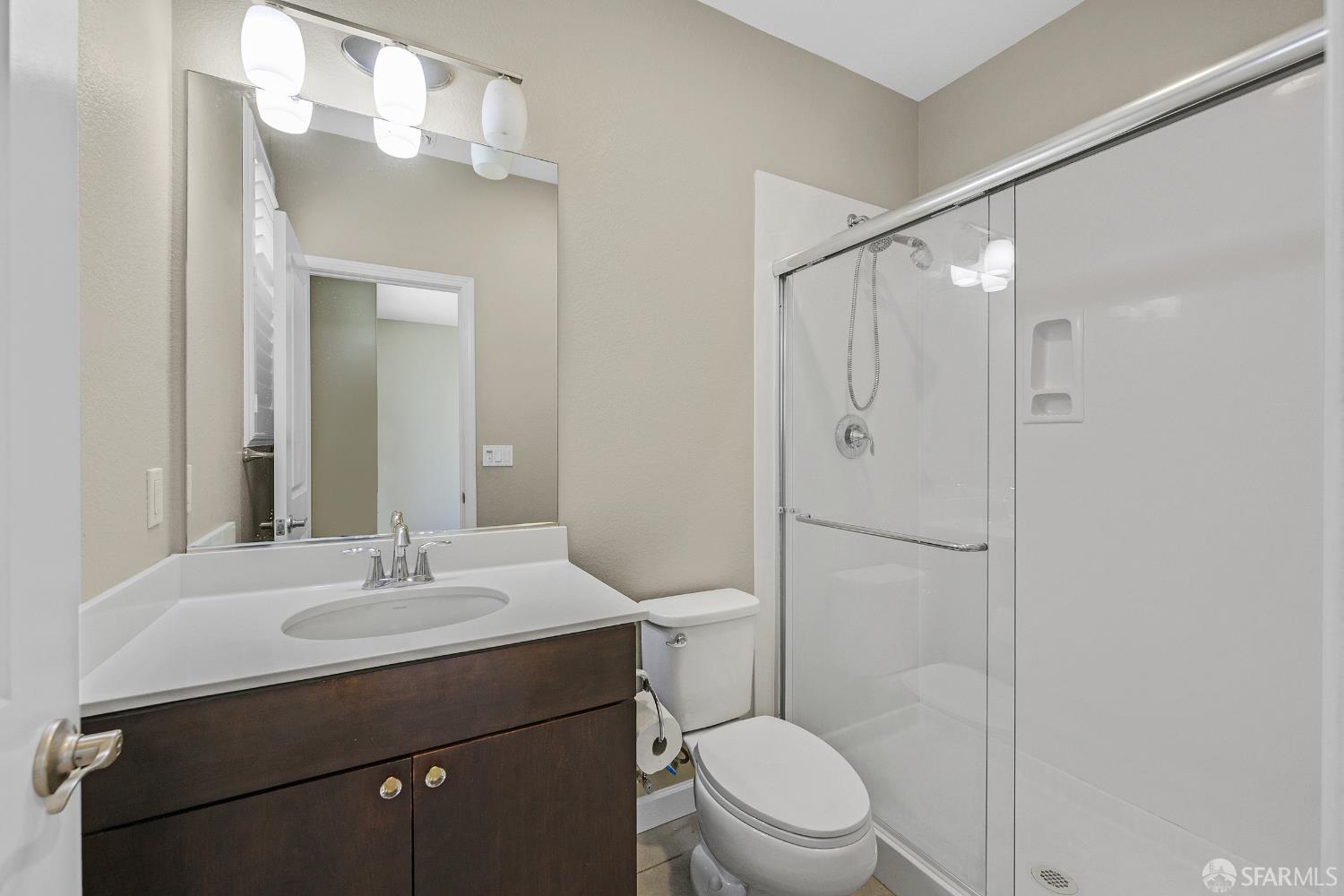 2908 Worthing Common Livermore, CA 94550 - Photo 27 of 33 a bathroom with a sink a toilet and shower