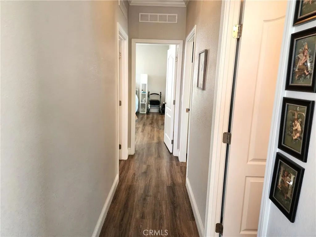 500 Atascadero, Unit E02 Morro Bay, CA 93442 - Photo 23 of 40 a view of a hallway with wooden floor and staircase