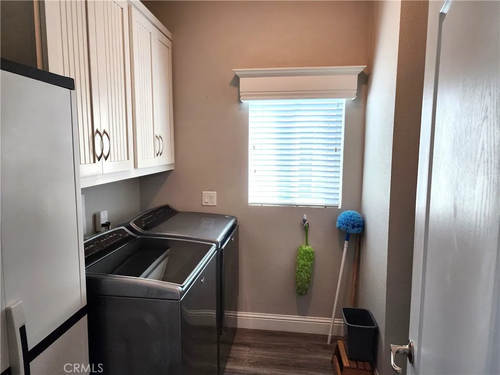 500 Atascadero, Unit E02 Morro Bay, CA 93442 - Photo 25 of 40 a room with wooden floor and a window