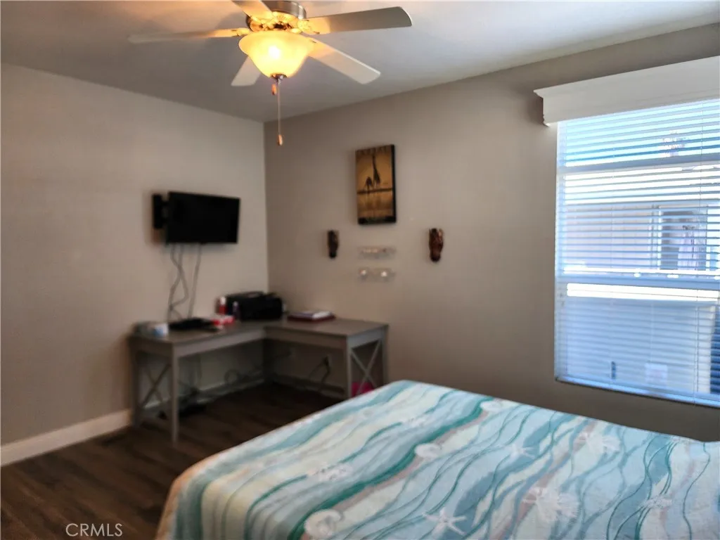 500 Atascadero, Unit E02 Morro Bay, CA 93442 - Photo 30 of 40 a bedroom with a bed and a window