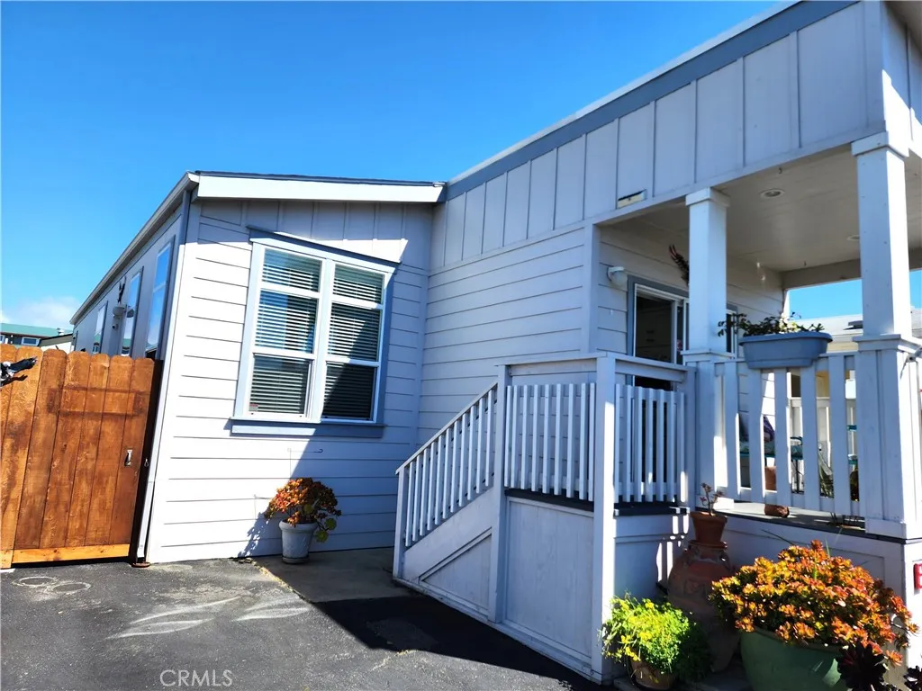500 Atascadero, Unit E02 Morro Bay, CA 93442 - Photo 35 of 40 a view of a house with a wooden bench
