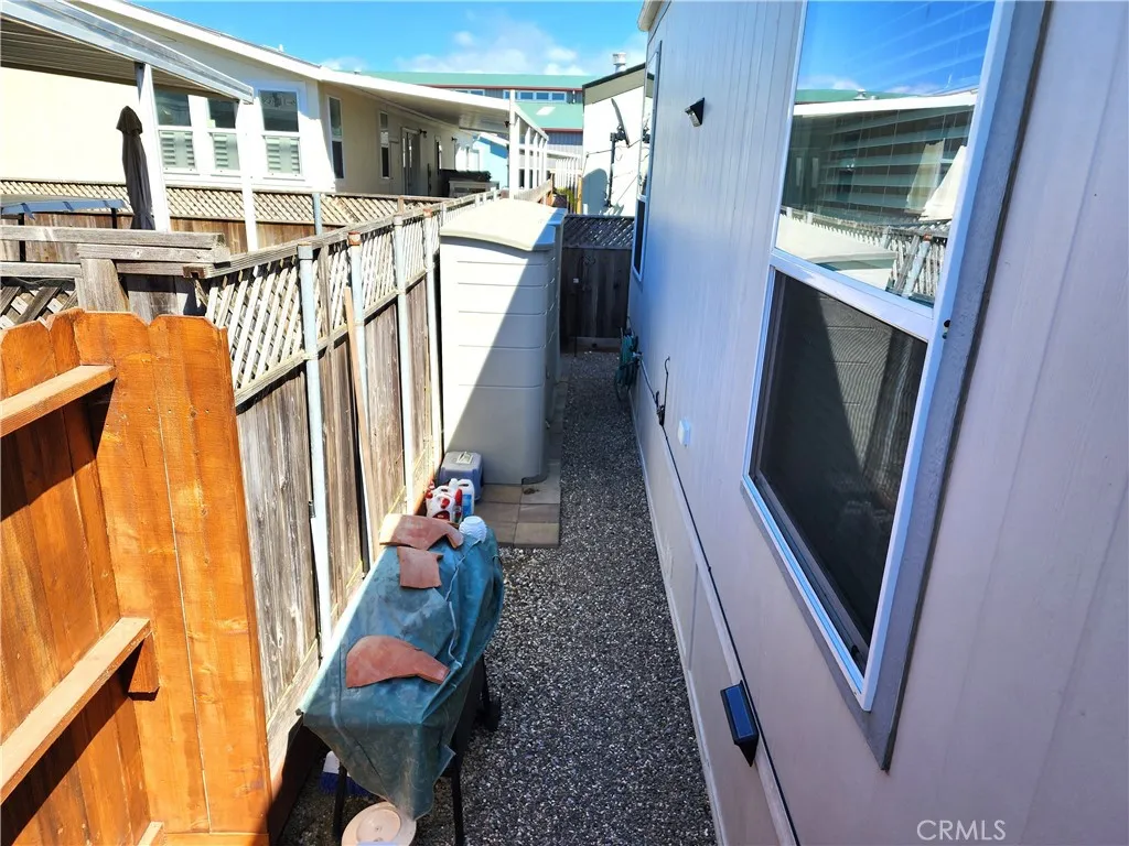 500 Atascadero, Unit E02 Morro Bay, CA 93442 - Photo 38 of 40 a view of a kitchen with wooden floor and electronic appliances