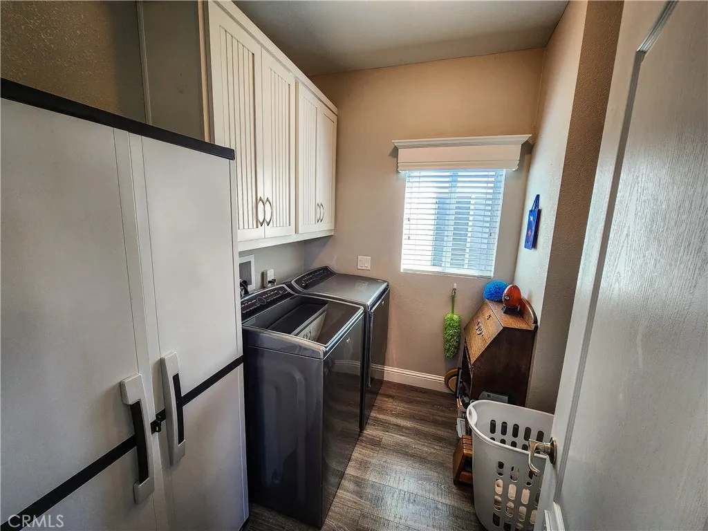 500 Atascadero, Unit E02 Morro Bay, CA 93442 - Photo 8 of 40 a room with furniture and wooden floor