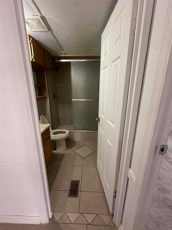 6445 Southeast 173 Lane Summerfield, FL 34491 - Photo 18 of 42 a bathroom with a sink a toilet and shower