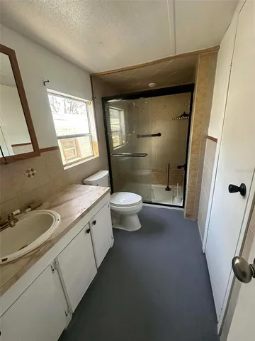 an empty room with a empty space and windows