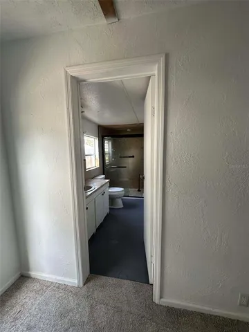 an empty room with a empty space and windows