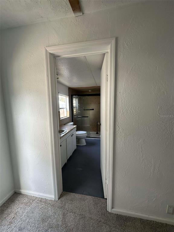 6445 Southeast 173 Lane Summerfield, FL 34491 - Photo 21 of 42 a view of a hallway with a livingroom and a couch