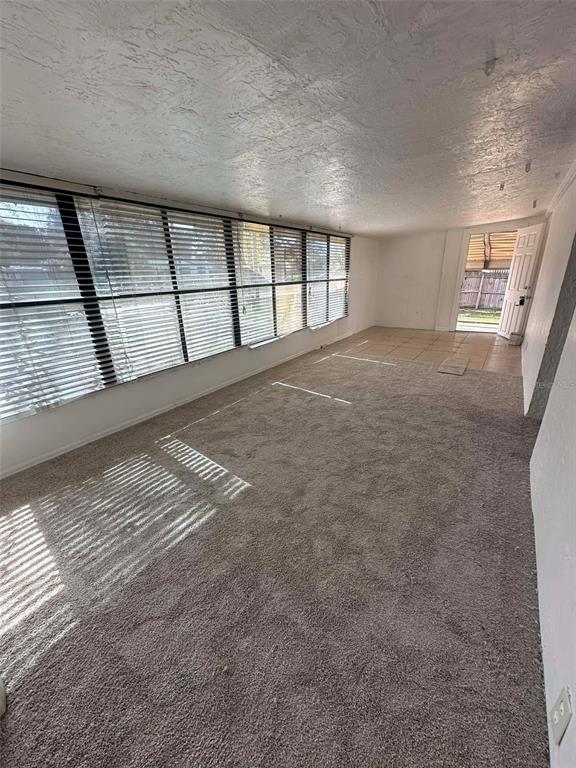 6445 Southeast 173 Lane Summerfield, FL 34491 - Photo 8 of 42 a view of an empty room with a window