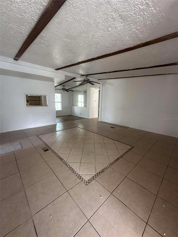 6445 Southeast 173 Lane Summerfield, FL 34491 - Photo 9 of 42 a view of a livingroom with an empty space and a window