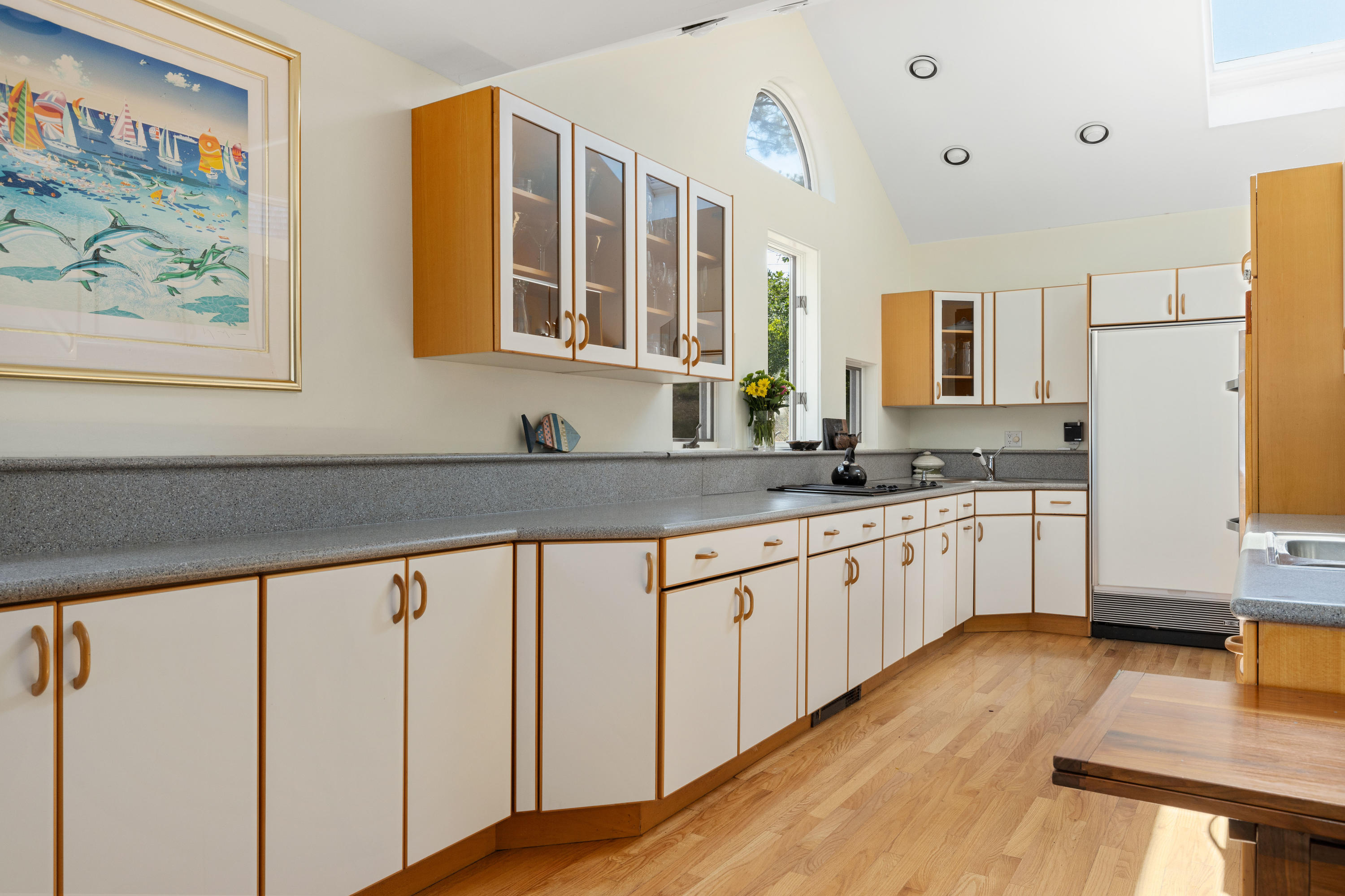 265 King Phillip Road Wellfleet, MA 02667 - Photo 11 of 85 a kitchen with stainless steel appliances granite countertop a stove a sink and white cabinets with wooden floor