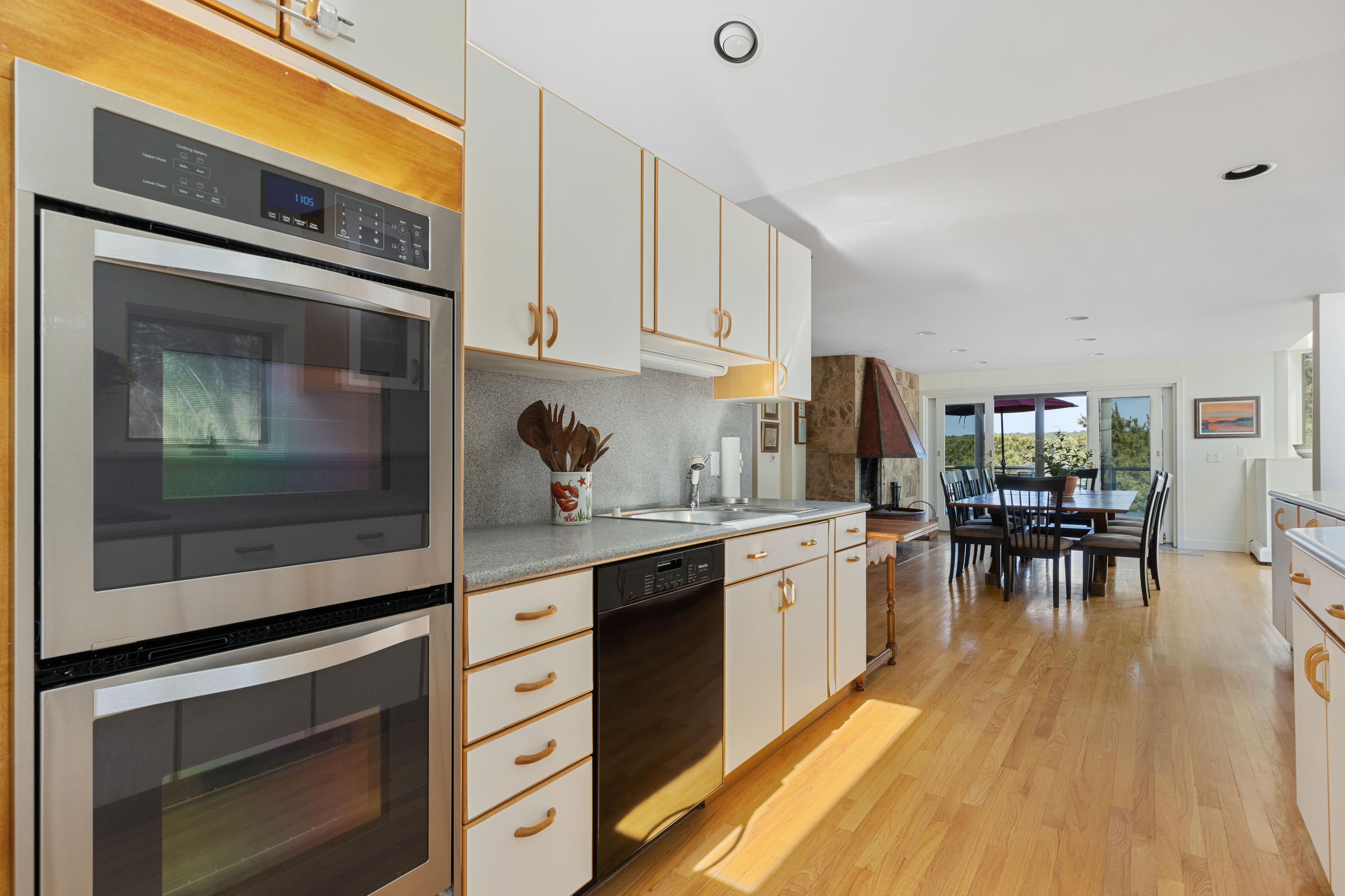 265 King Phillip Road Wellfleet, MA 02667 - Photo 14 of 85 a kitchen with stainless steel appliances a stove a sink and cabinets