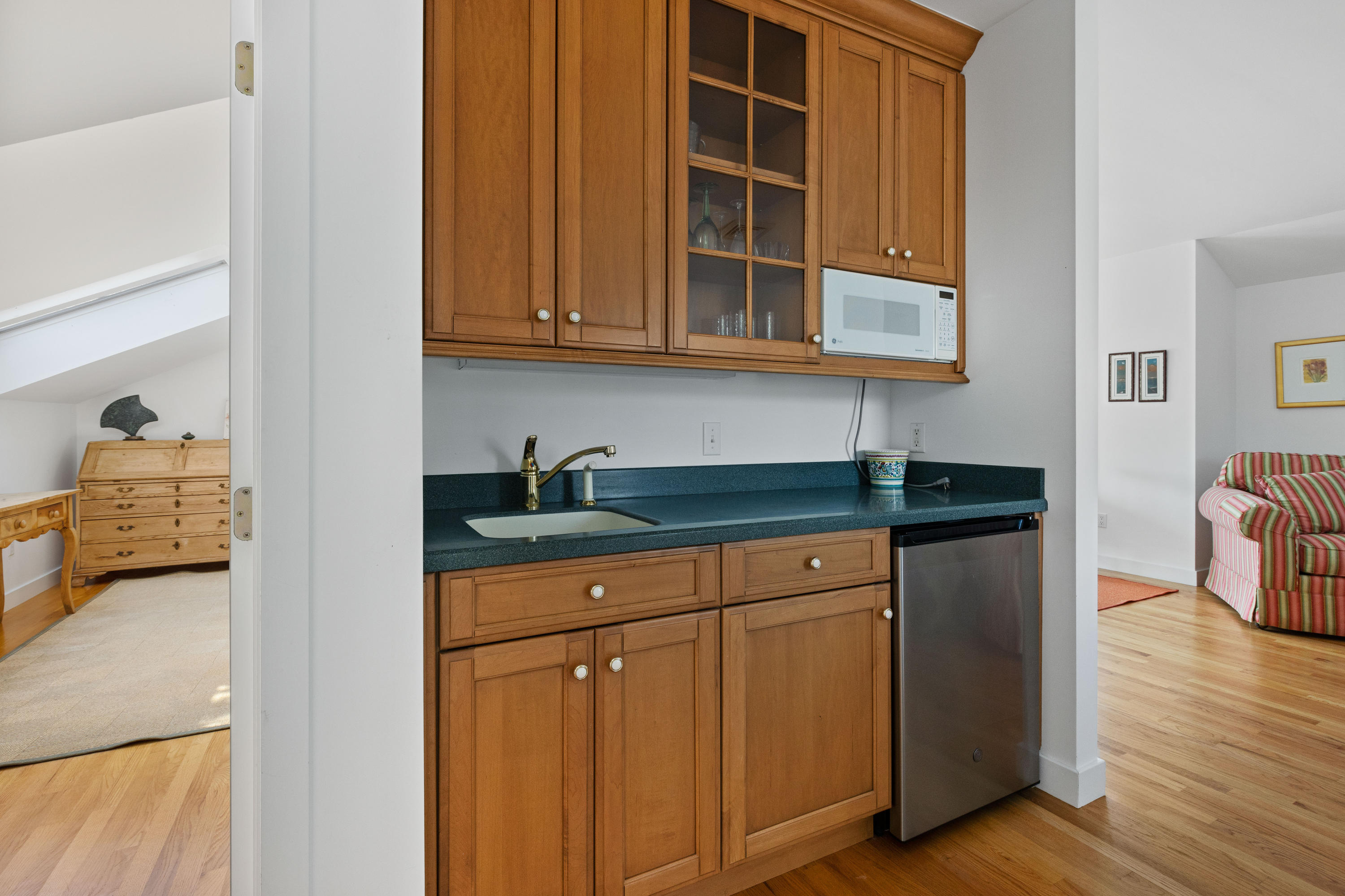 265 King Phillip Road Wellfleet, MA 02667 - Photo 58 of 85 a kitchen with stainless steel appliances granite countertop a sink and cabinets
