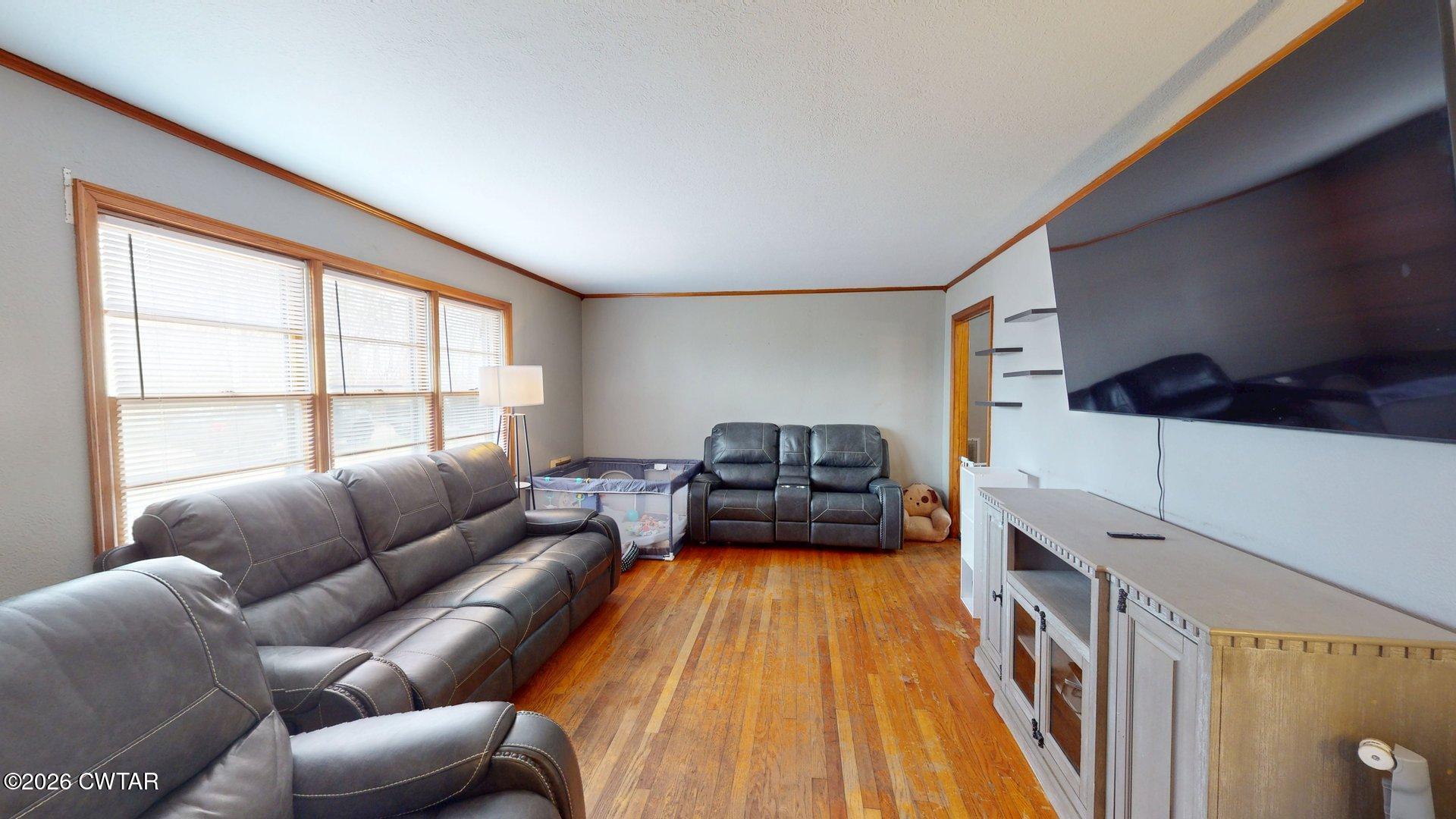 328 Terrell Road Martin, TN 38237 - Photo 7 of 18 a living room with furniture a couch and two windows