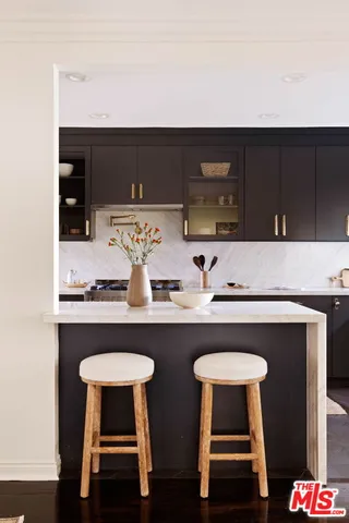 a kitchen with a table and chairs in it