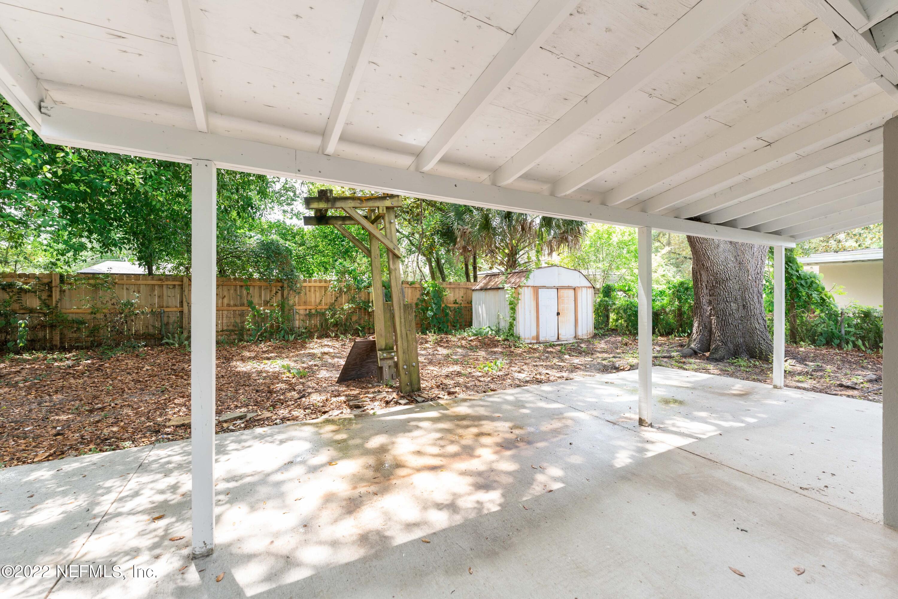 6216 Temple Road Jacksonville, FL 32217 - Photo 21 of 25 a view of a couches under an umbrella