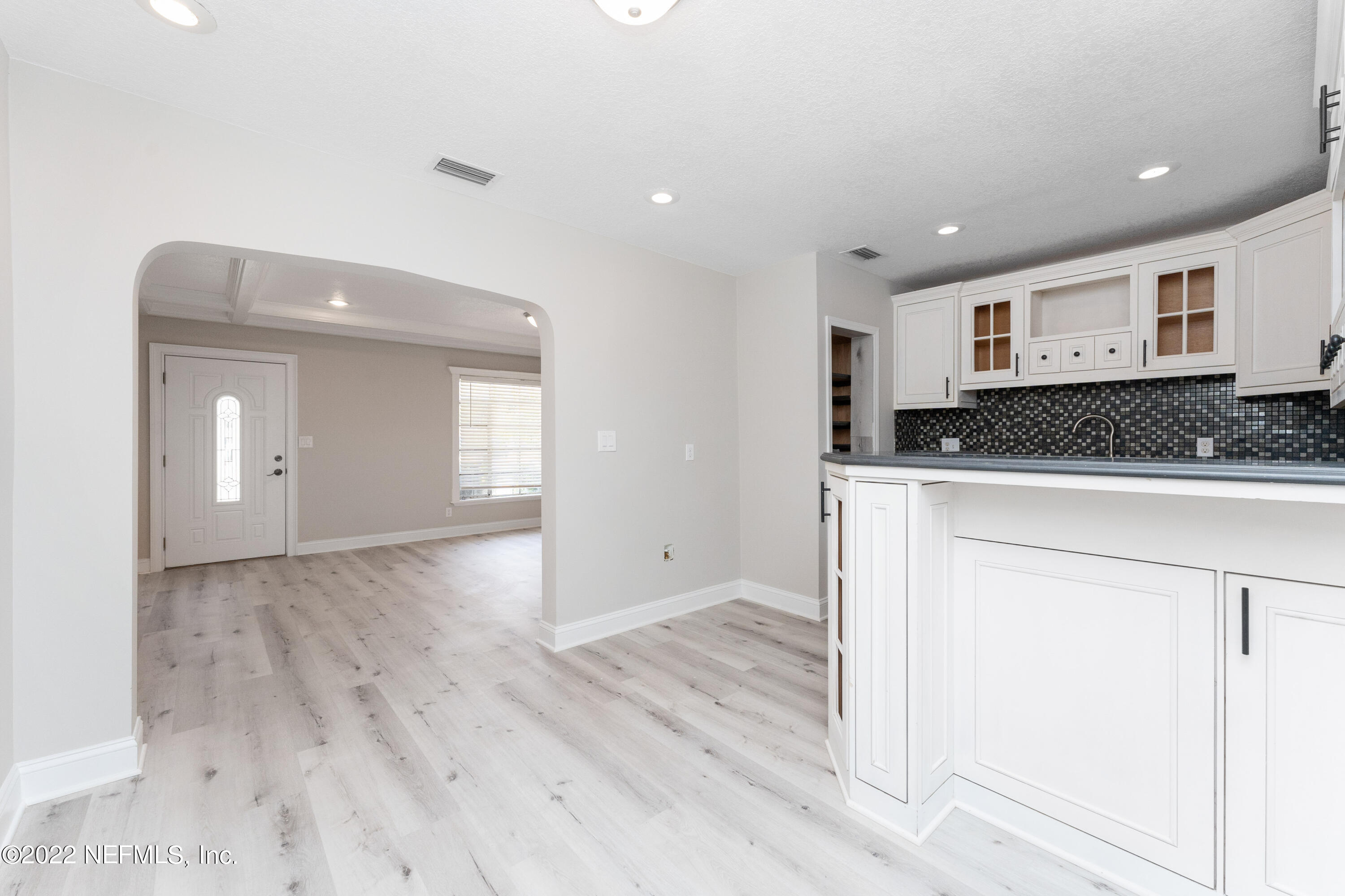 6216 Temple Road Jacksonville, FL 32217 - Photo 7 of 25 a kitchen with granite countertop a sink and cabinets
