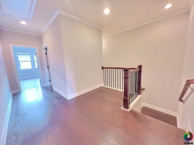 a view of a hallway with entryway to a bedroom