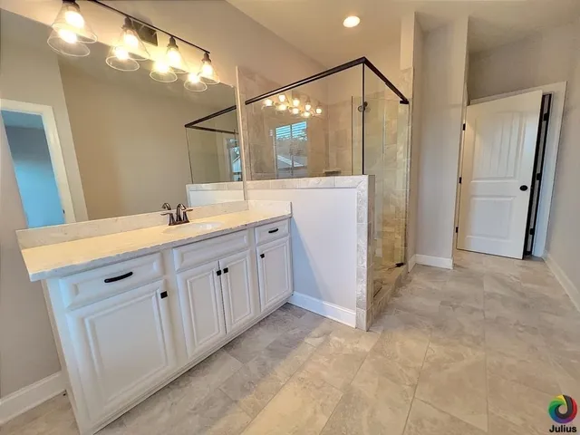 a bathroom with a double vanity sink and mirror