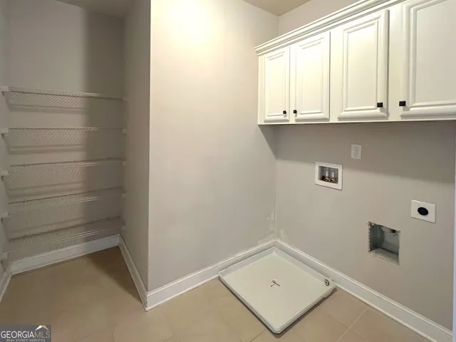 a bathroom with a sink and cabinets