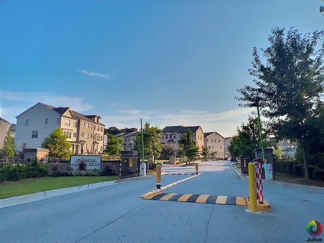 a view of a patio with table and chairs potted plants and a palm tree