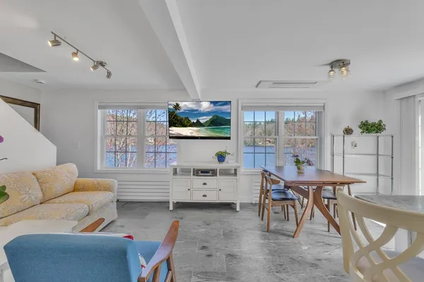 a view of a livingroom with furniture and windows