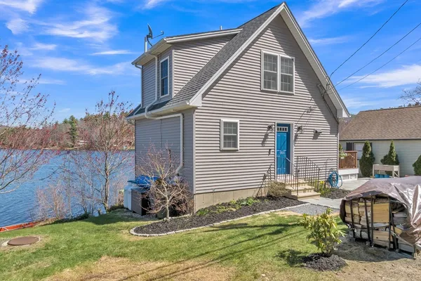 a view of backyard with a garden and plants