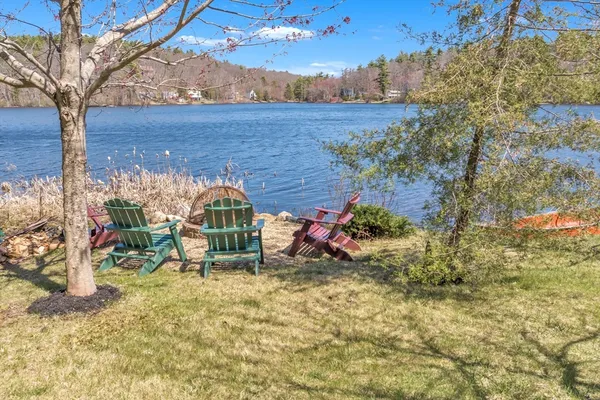 a view of a bench in backyard of the house