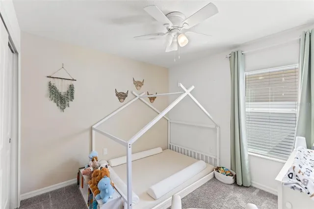 a living room with a ceiling fan