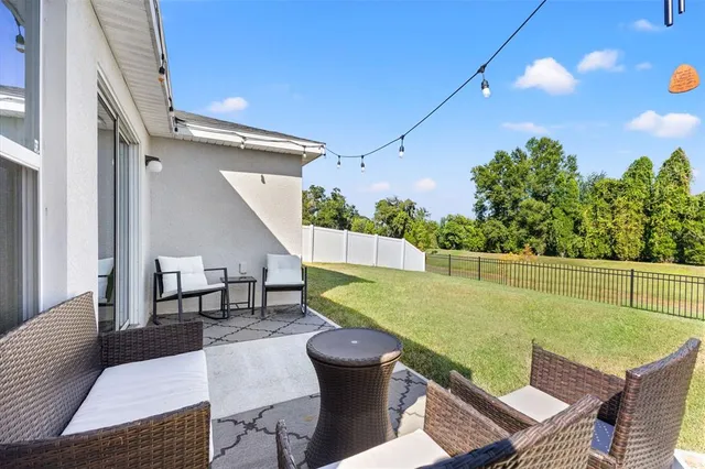 a view of a patio with couches table and chairs