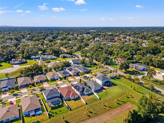 an aerial view of residential houses with outdoor space