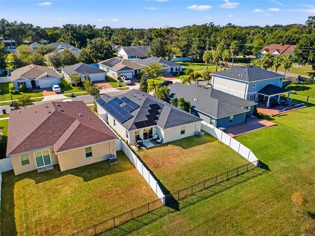 an aerial view of a house with a swimming pool