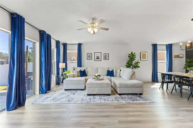 a living room with furniture and a large window