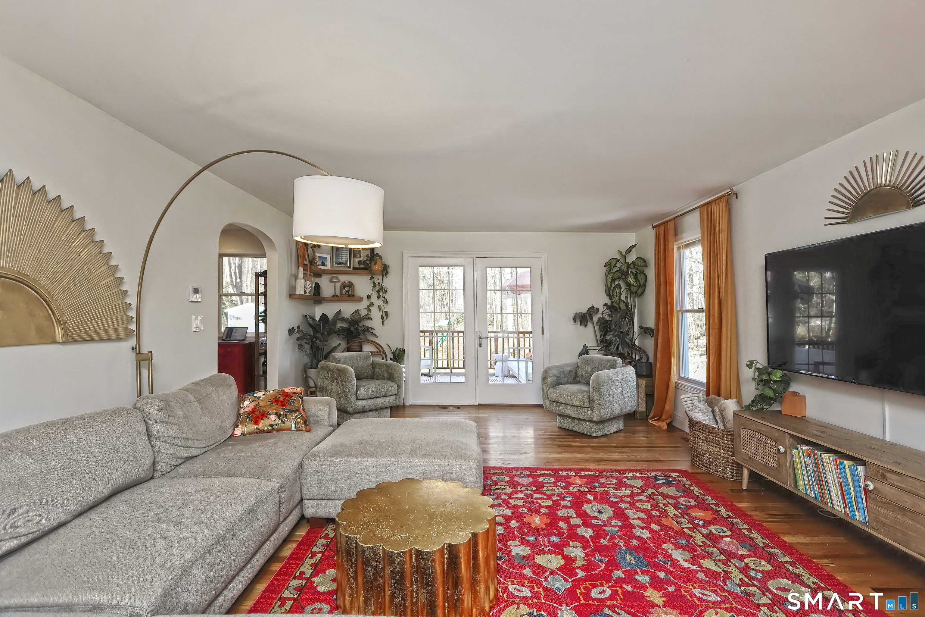 215 Wheeler Road Monroe, CT 06468 - Photo 10 of 22 a living room with furniture chess table and a chandelier