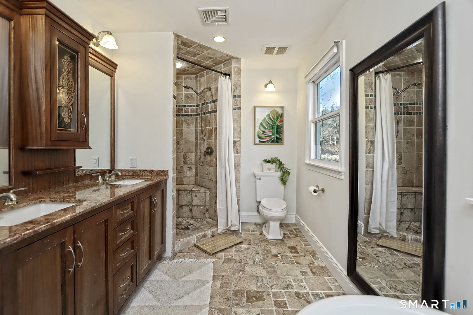 215 Wheeler Road Monroe, CT 06468 - Photo 15 of 22 a spacious bathroom with a granite countertop sink toilet and shower