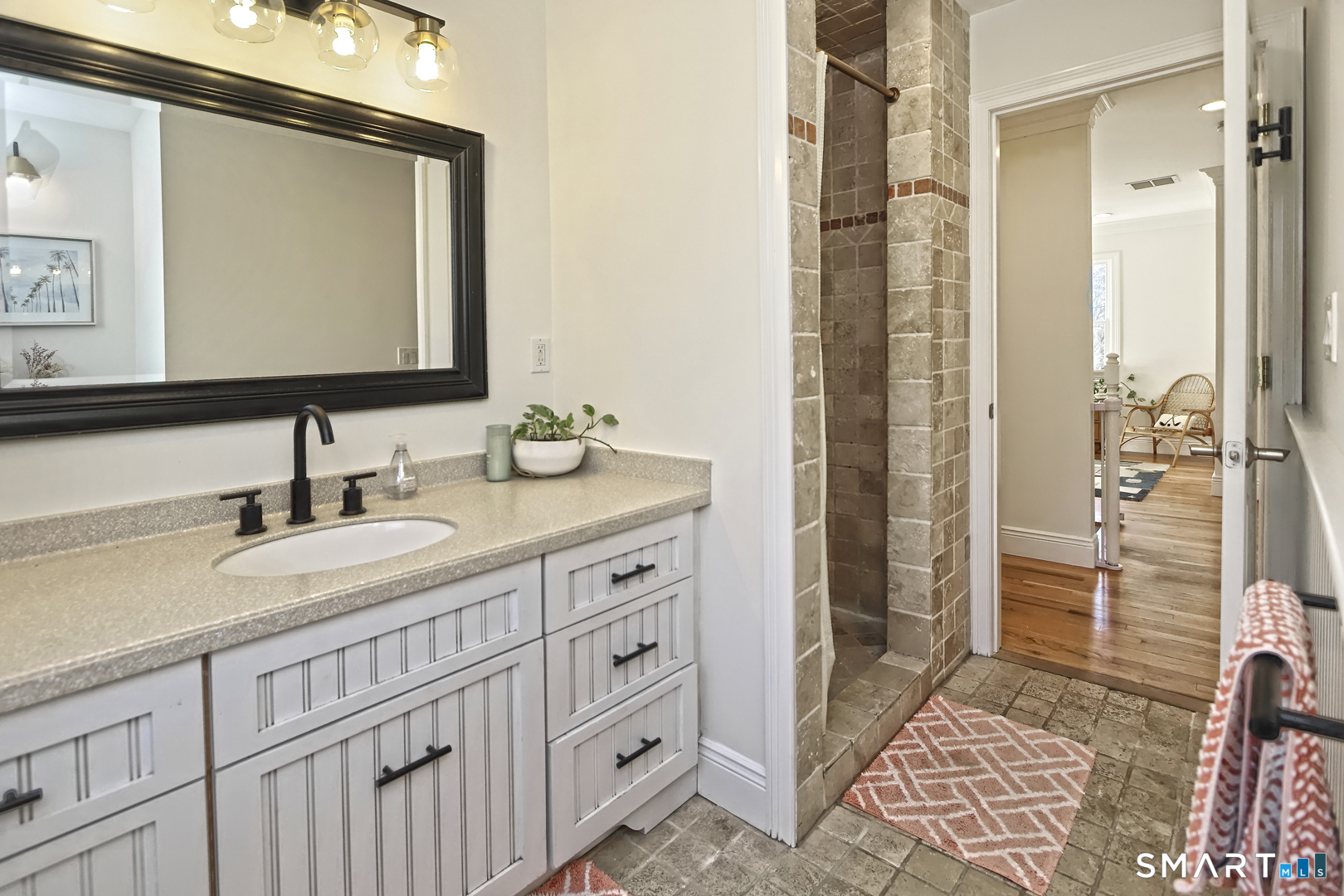 215 Wheeler Road Monroe, CT 06468 - Photo 17 of 22 a bathroom with double vanity sink and a mirror
