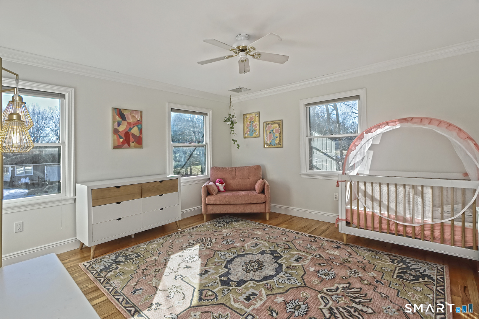 215 Wheeler Road Monroe, CT 06468 - Photo 18 of 22 a living room with furniture and a baby crib