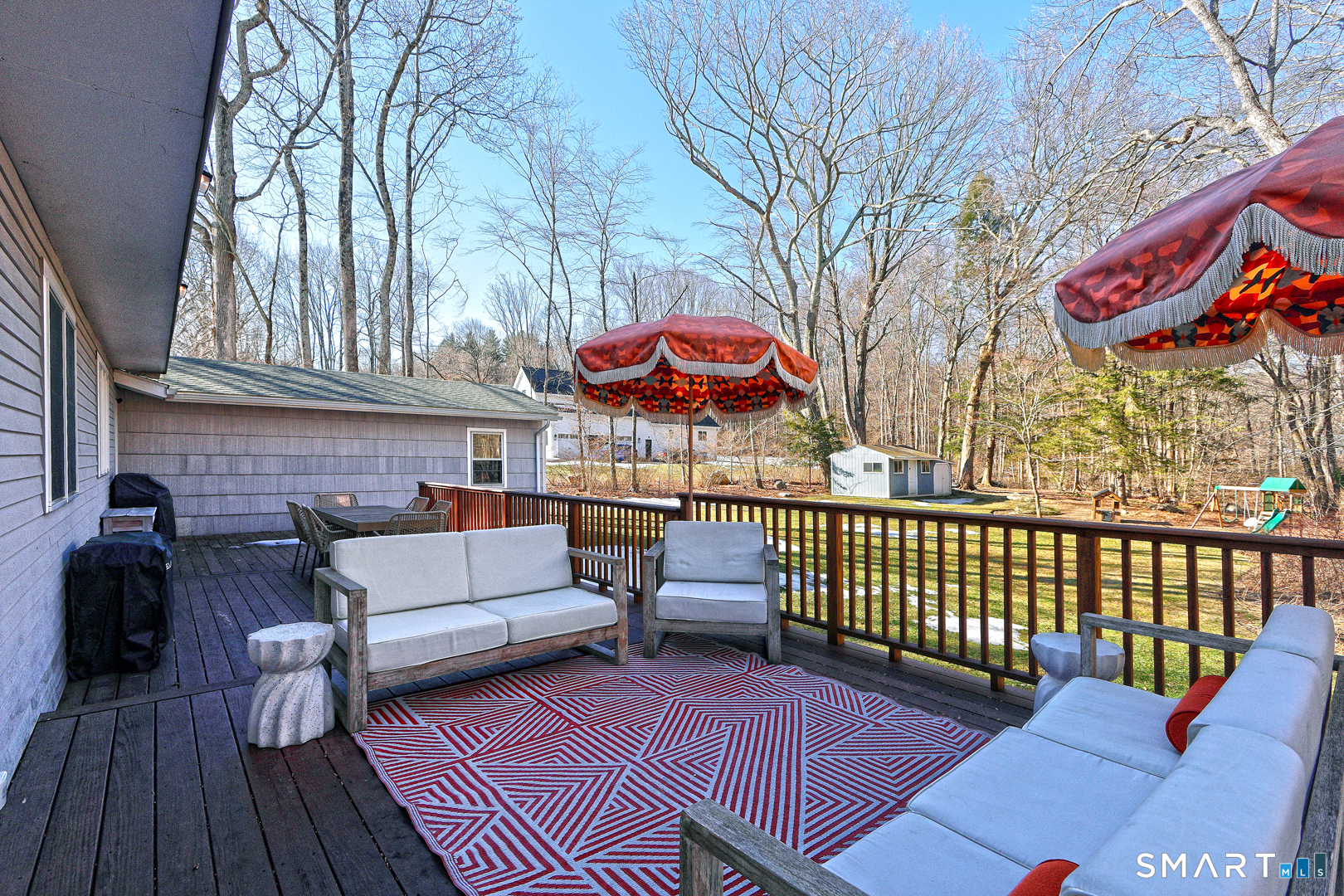 215 Wheeler Road Monroe, CT 06468 - Photo 20 of 22 a view of a patio with couches table and chairs and wooden floor