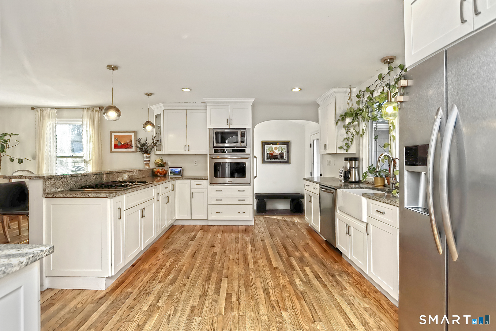 215 Wheeler Road Monroe, CT 06468 - Photo 5 of 22 a kitchen with stainless steel appliances a refrigerator sink and white cabinets