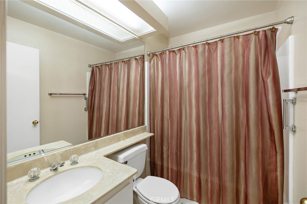 31375 Willowood Way Menifee, CA 92584 - Photo 25 of 43 a bathroom with a sink and a mirror