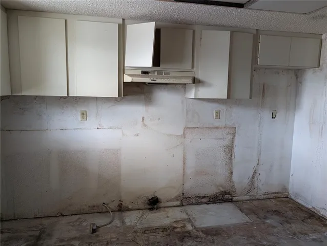 a view of a hallway with stairs