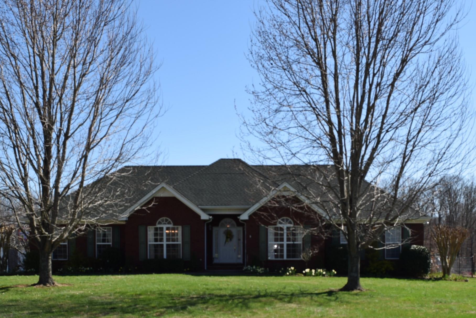 8936 Fredonia Road Manchester, TN 37355 - Photo 1 of 25 a view of a big house with a big yard and large trees