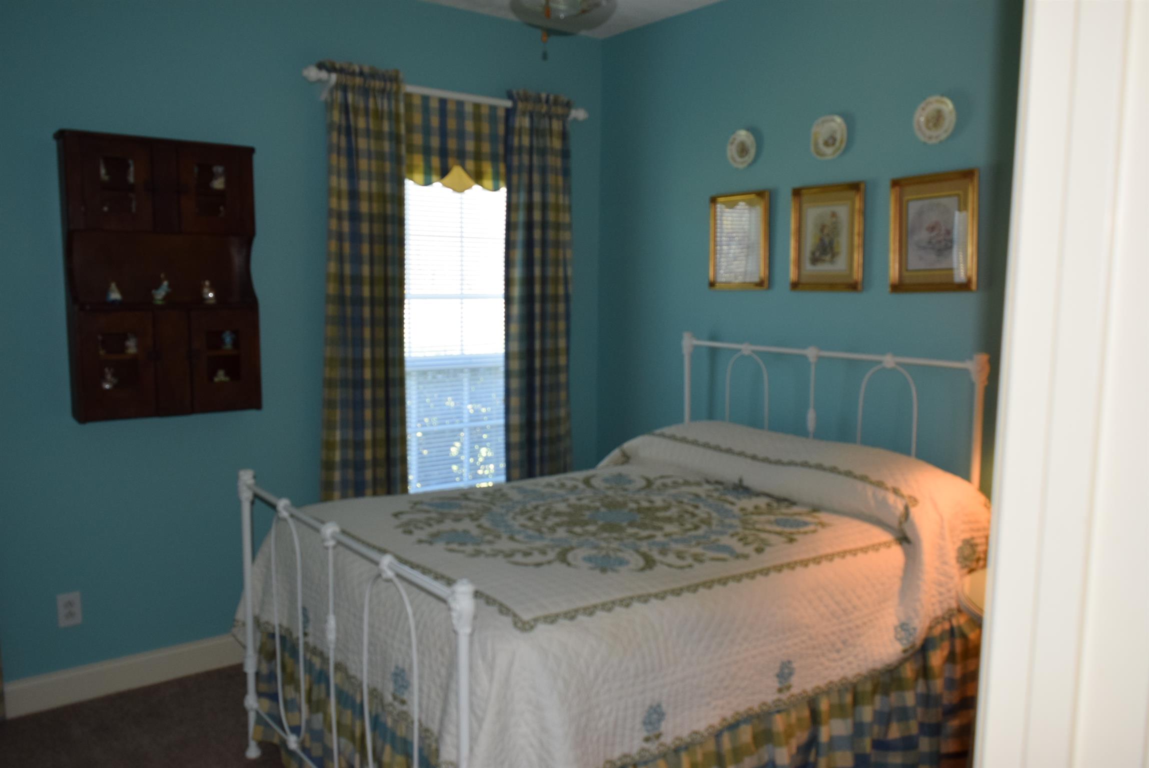 8936 Fredonia Road Manchester, TN 37355 - Photo 13 of 25 a bedroom with a bed and a window