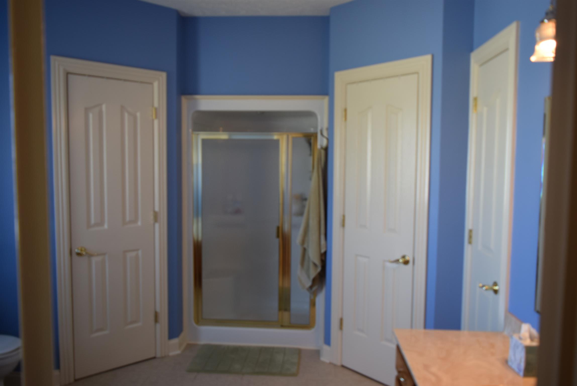 8936 Fredonia Road Manchester, TN 37355 - Photo 18 of 25 a view of room with a mirror and a wooden door
