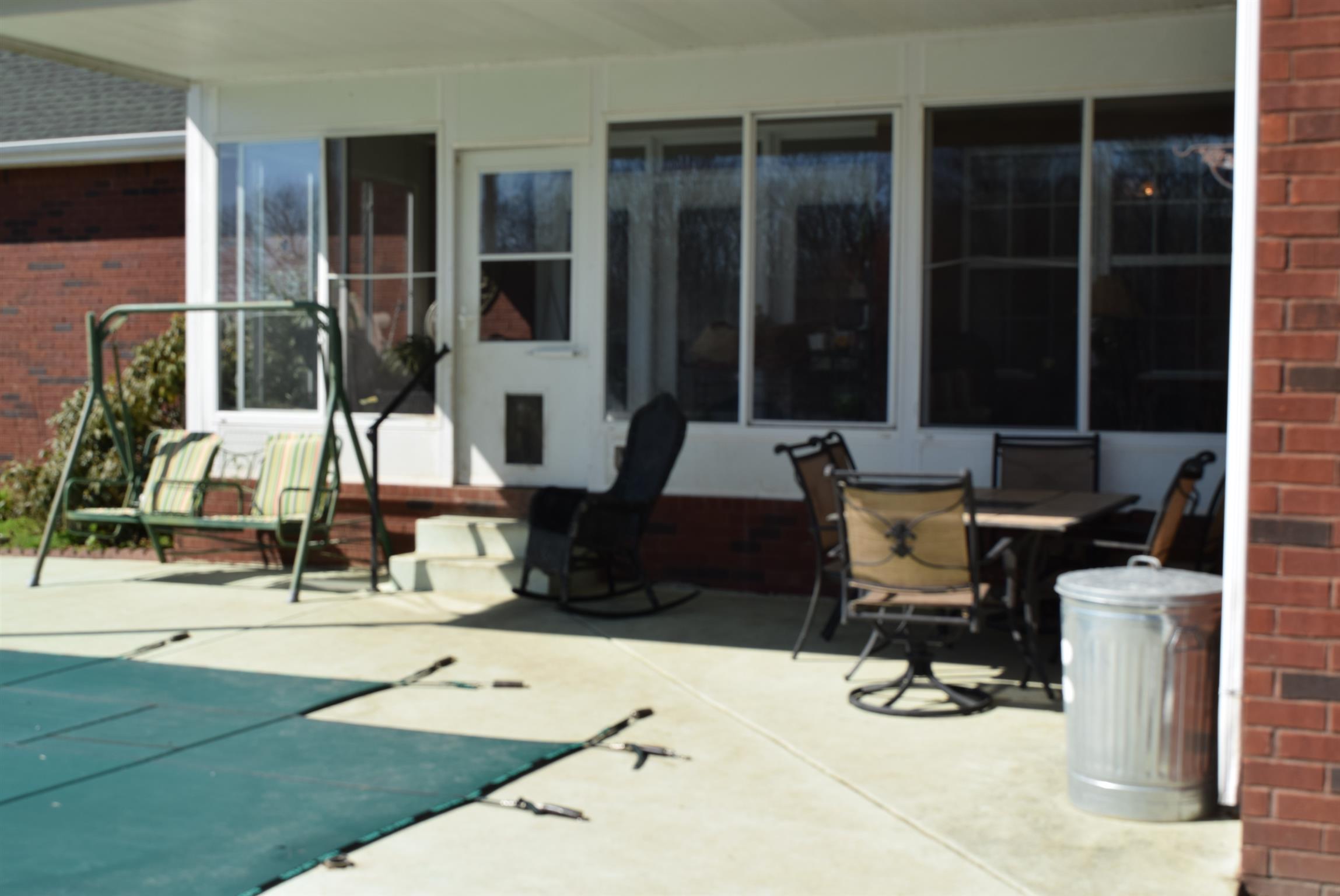 8936 Fredonia Road Manchester, TN 37355 - Photo 21 of 25 a building outdoor space with patio furniture and potted plants