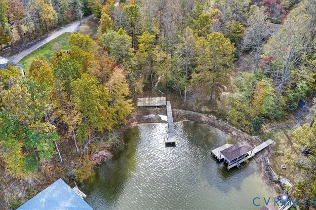 an aerial view of a house with a yard basket ball court