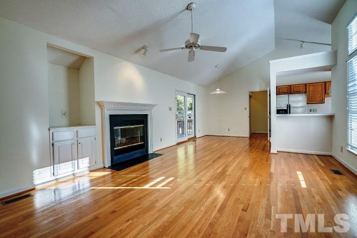 3913 Olde Coach Road Durham, NC 27707 - Photo 2 of 17 a view of a room wooden floor and a kitchen